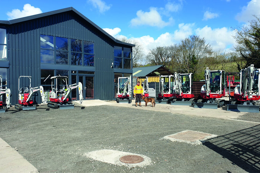 mann hire depot with takeuchi excavators lined up in front