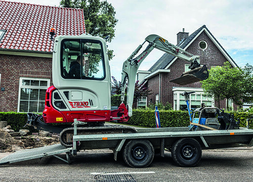 tb320 takeuchi excavator driving on to trailer